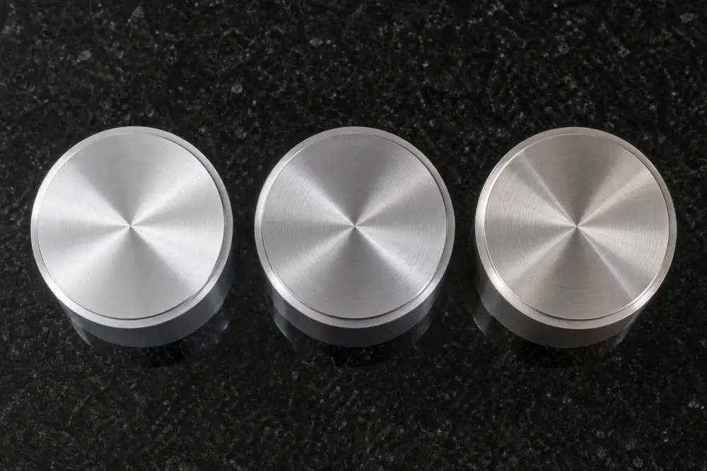 Visual comparison of Type III hard anodized layers across 6061, 7075, and 2024 aluminum alloys showing distinct natural colorations Visual comparison of Type III hard anodized layers across 6061, 7075, and 2024 aluminum alloys showing distinct natural colorations